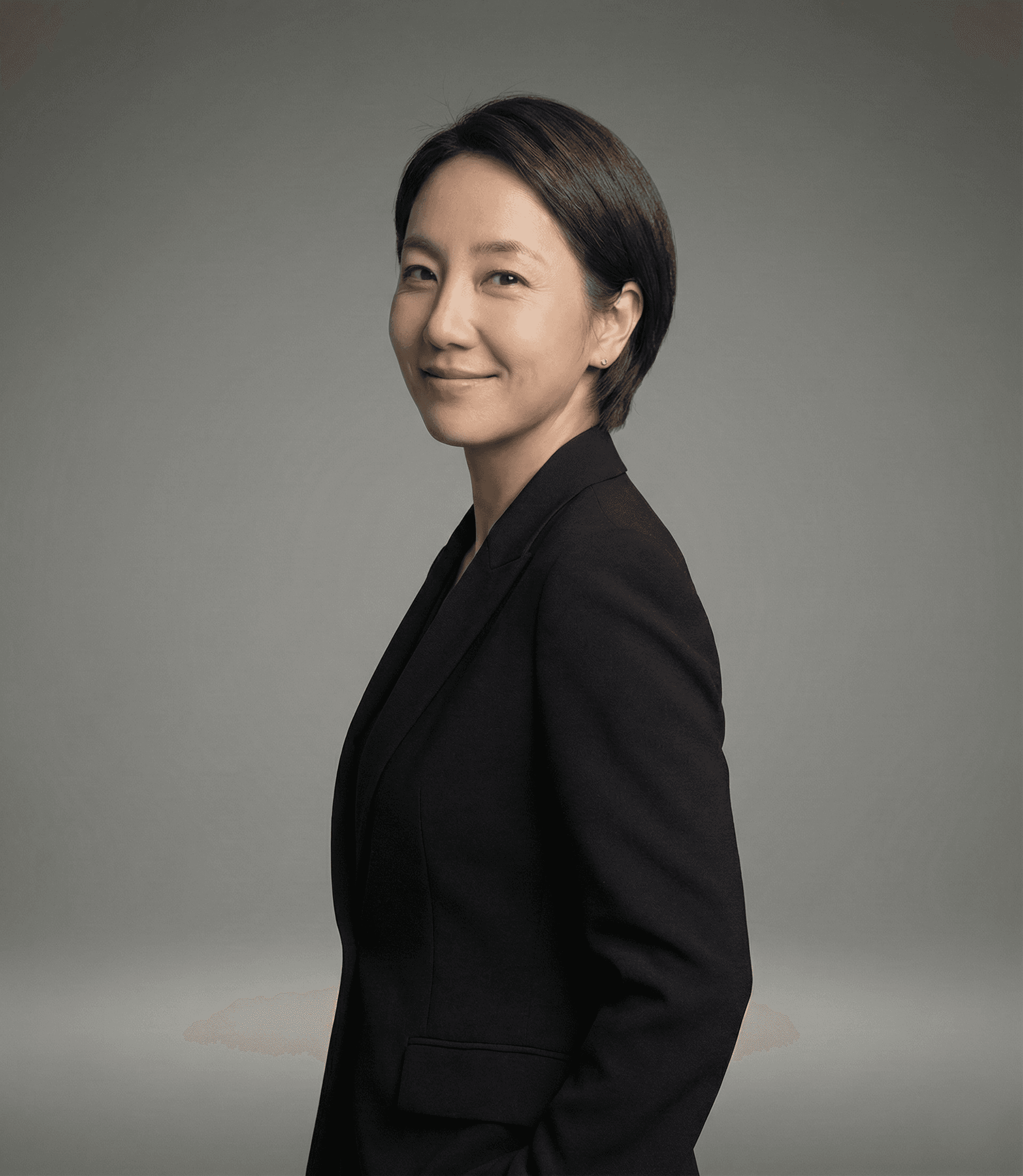 Luna, Director at Miin Singapore with long dark hair and scarf