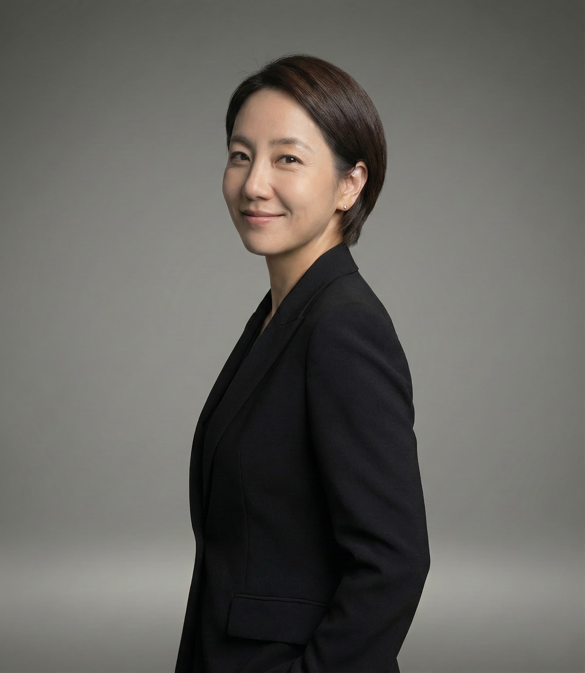 Luna, Director at Miin Singapore with long dark hair and scarf